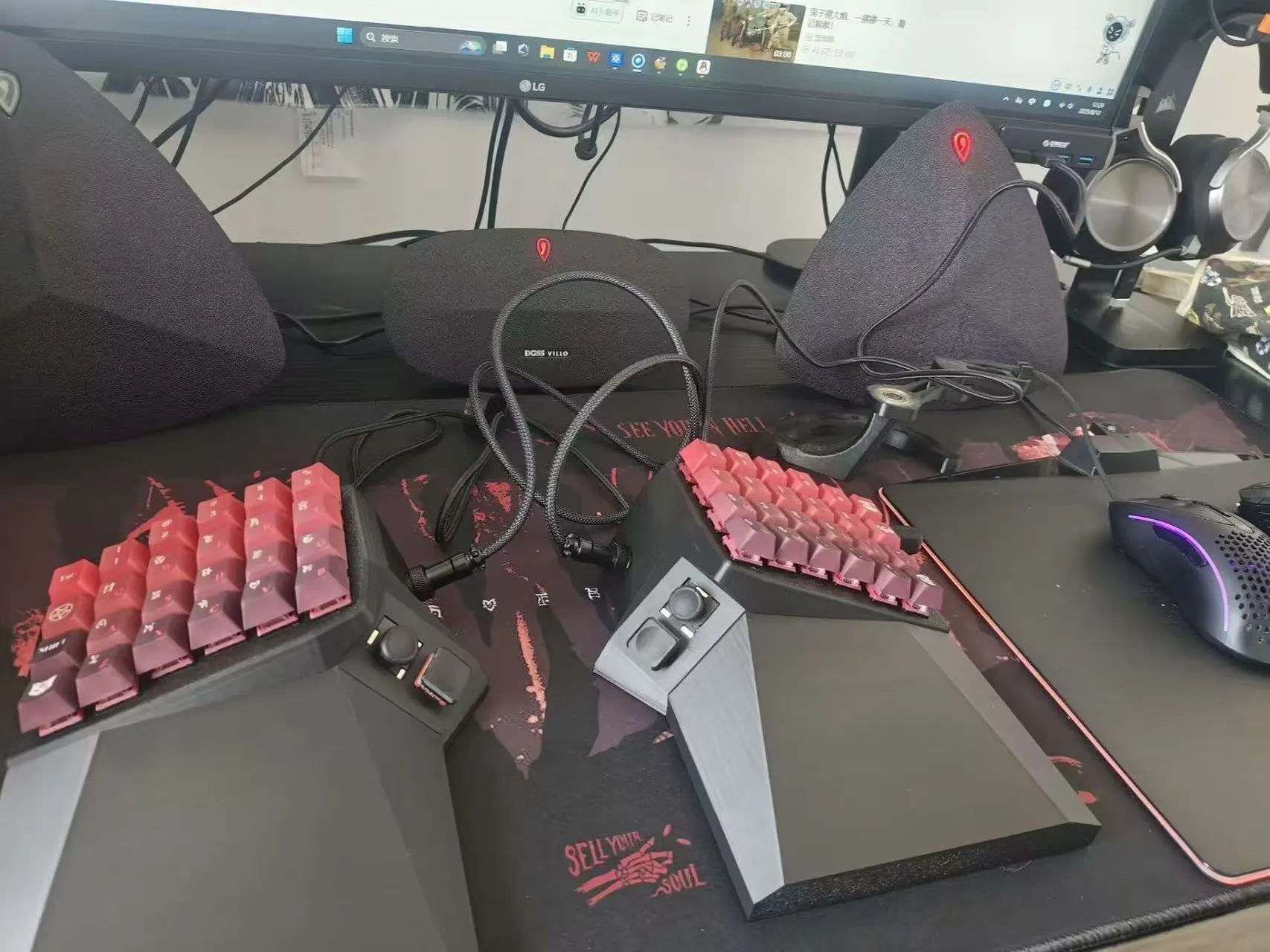 Black OS Keyboard with red keycaps on a gaming desk